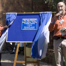 Chief Superintendent Benny Adams and Mr Renney Plit unveiling the plaque